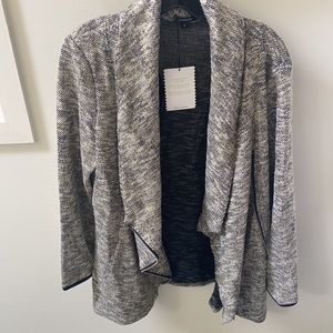 Metallic silver, gold and black jacket.